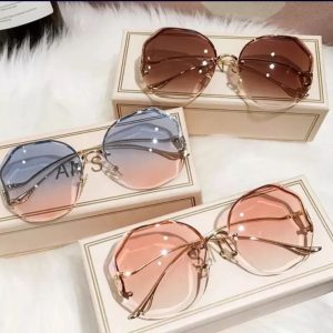 Brown Rimless Glasses by ou mackson